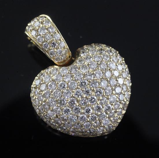 A modern 14ct gold and pave set diamond heart shaped pendant, overall 23mm.